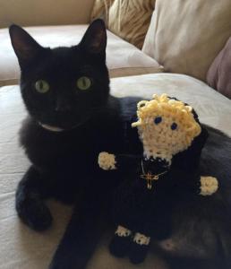 nun doll with cat